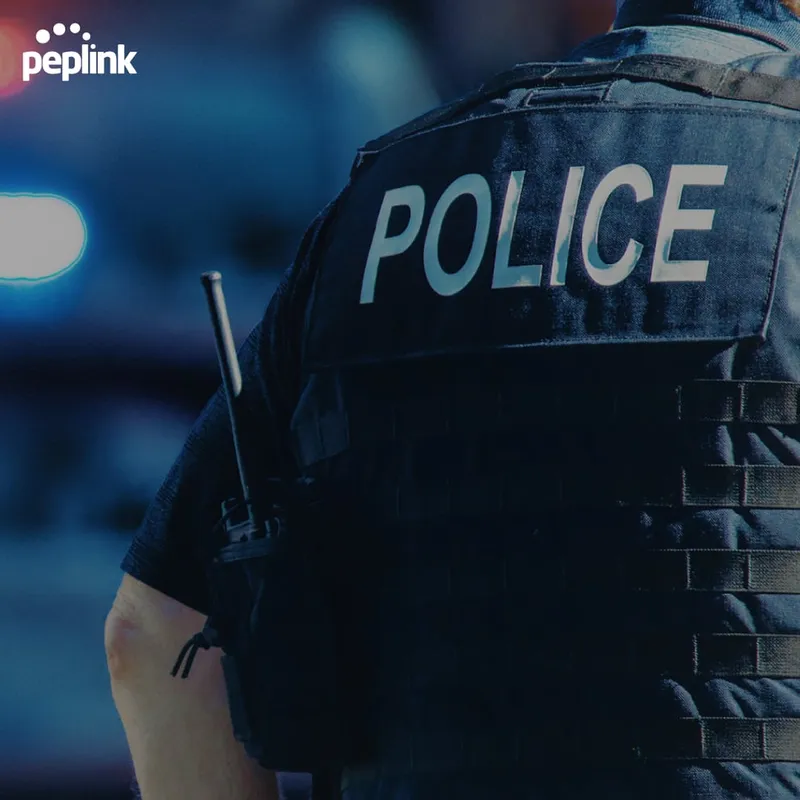 FIPS License for HD2 with MediaFast on Peplink device shown on police officer’s tactical vest during emergency response.