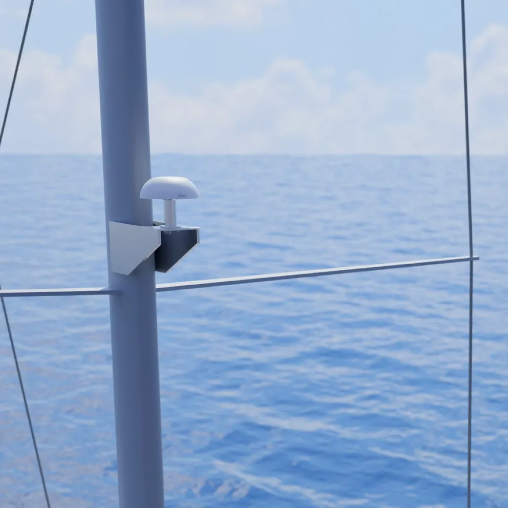 White Pepwave marine antenna mounted on a grey pole against an ocean backdrop for TA Cloud Appliance connectivity