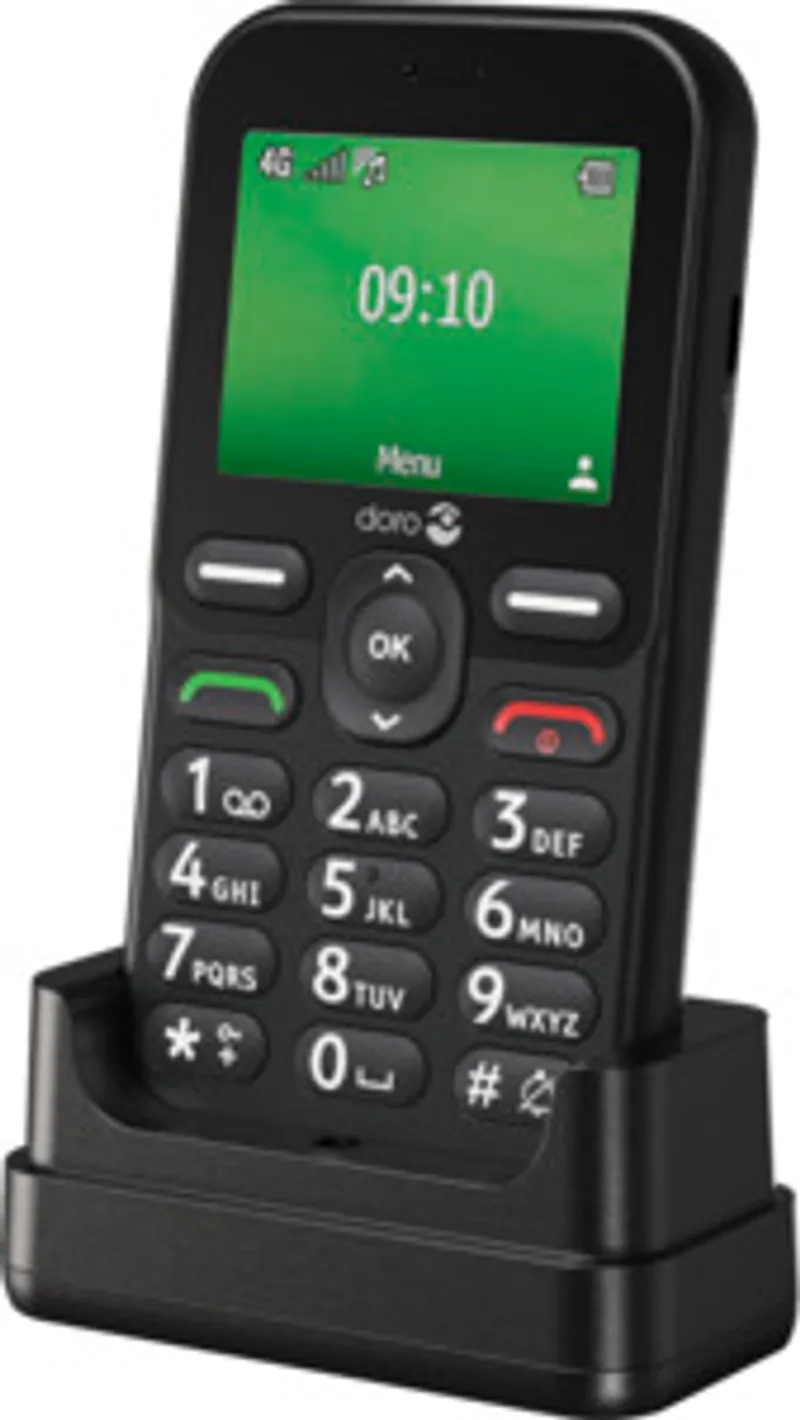 Teléfono Doro Leva E10 LTE negro en base de carga con pantalla encendida mostrando la hora 09:10 y teclado físico iluminado.