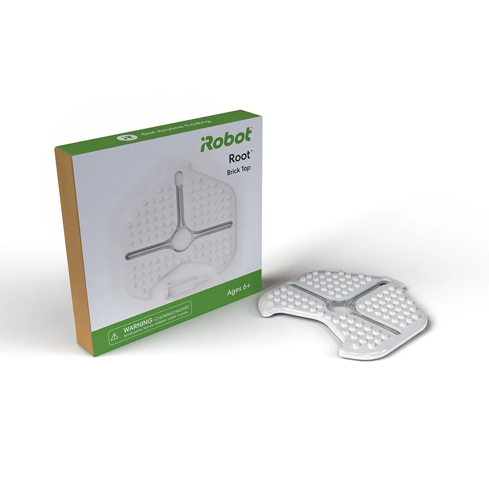 iRobot Root Brick Top Accessory box with green accents and product illustration next to the white plastic studded plate iRobot Root Brick Top Accessory box with green accents and product illustration next to the white plastic studded plate