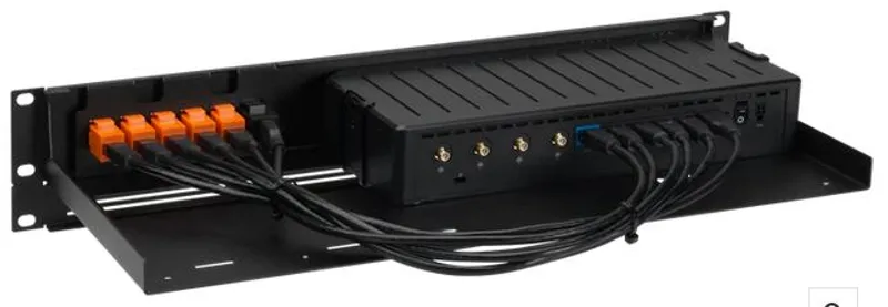 Rackmount.IT Kit for Cradlepoint E100 series, black rackmount shelf with Cradlepoint device and routed cables to orange
