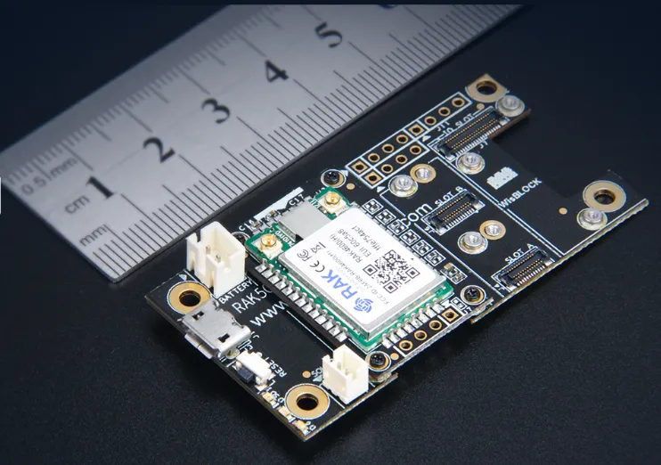 RAK4600 WisDuo LoRa evaluation board with USB-C, pin headers, and RAK-branded module next to a metal ruler for scale.