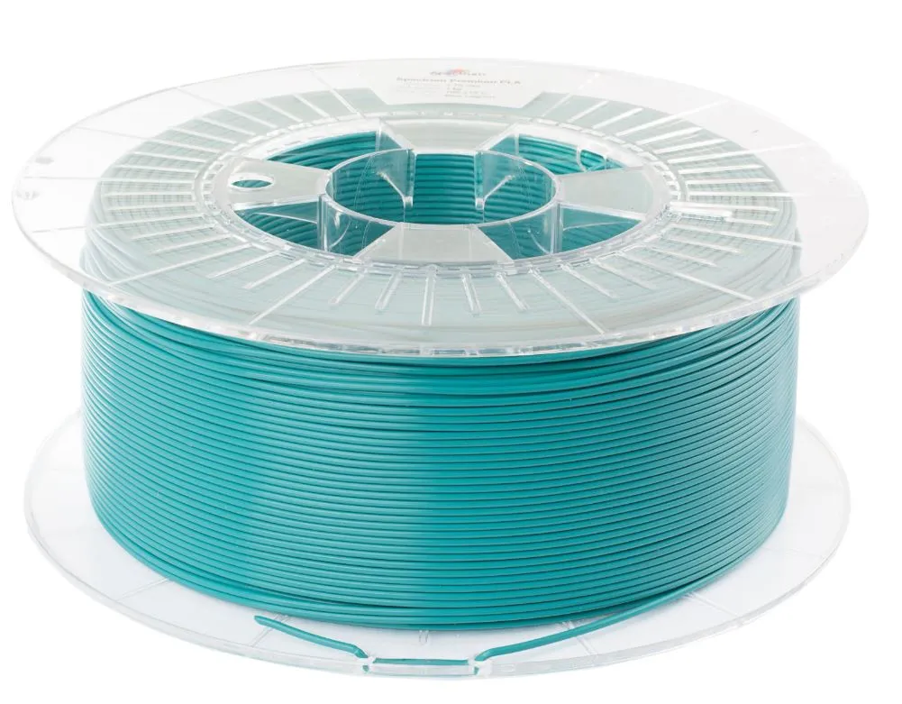 Spectrum 3D Filament PLA Premium 1,75mm Blue Lagoon, spool of teal-blue 3D printer filament on transparent plastic reel Spectrum 3D Filament PLA Premium 1,75mm Blue Lagoon, spool of teal-blue 3D printer filament on transparent plastic reel