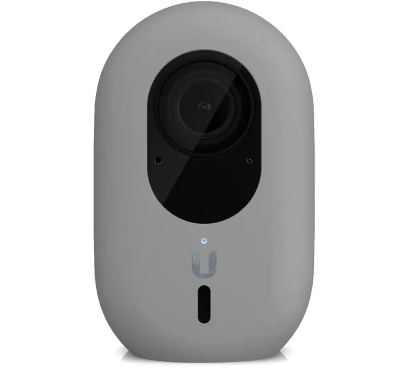 UniFi Protect G4 Instant Kameraabdeckung in Grau mit schwarzem Objektiv, blauem LED-Licht und Ubiquiti-Logo für sichere